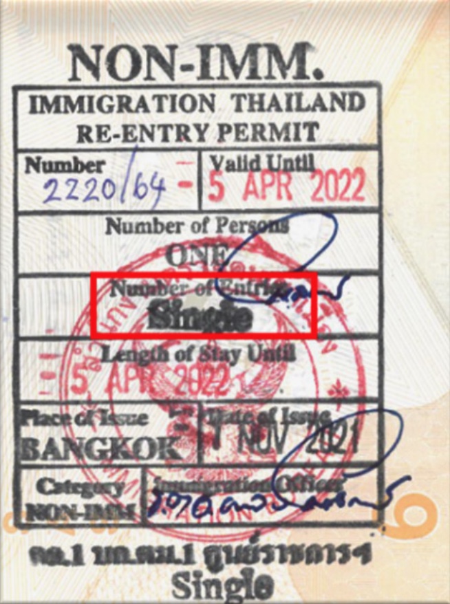 Foreign traveler applying for a re-entry permit at Thai immigration before leaving Thailand to keep visa valid