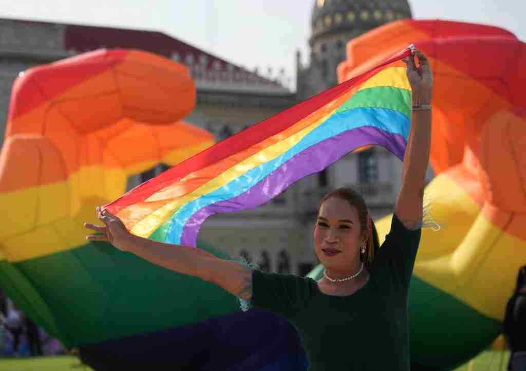 Same-Sex Marriage Registration in Thailand lady with a rainbow flag to celebrate the new law